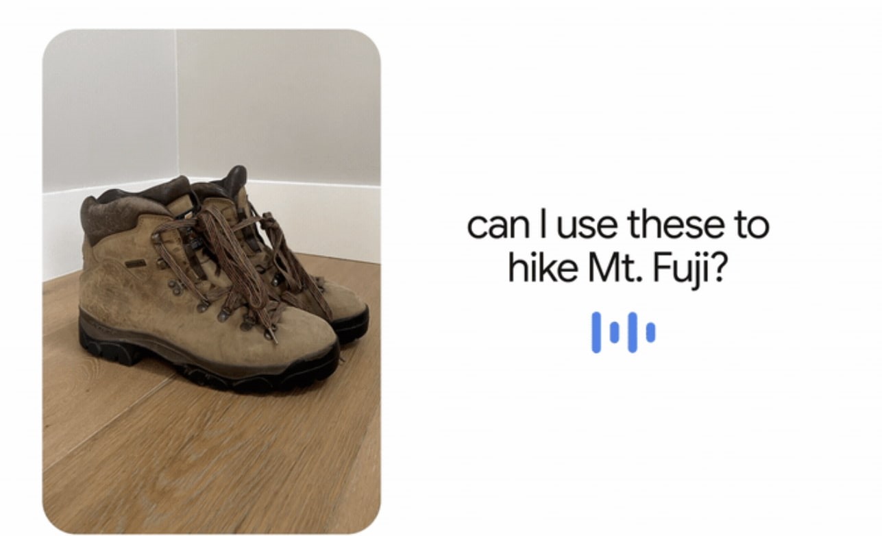 Google, yürüyüş botlarının bir fotoğrafıyla birlikte sesli arama örneğini ("Bunları Fuji Dağı'nda yürüyüş yapmak için kullanabilir miyim") kullanır. 